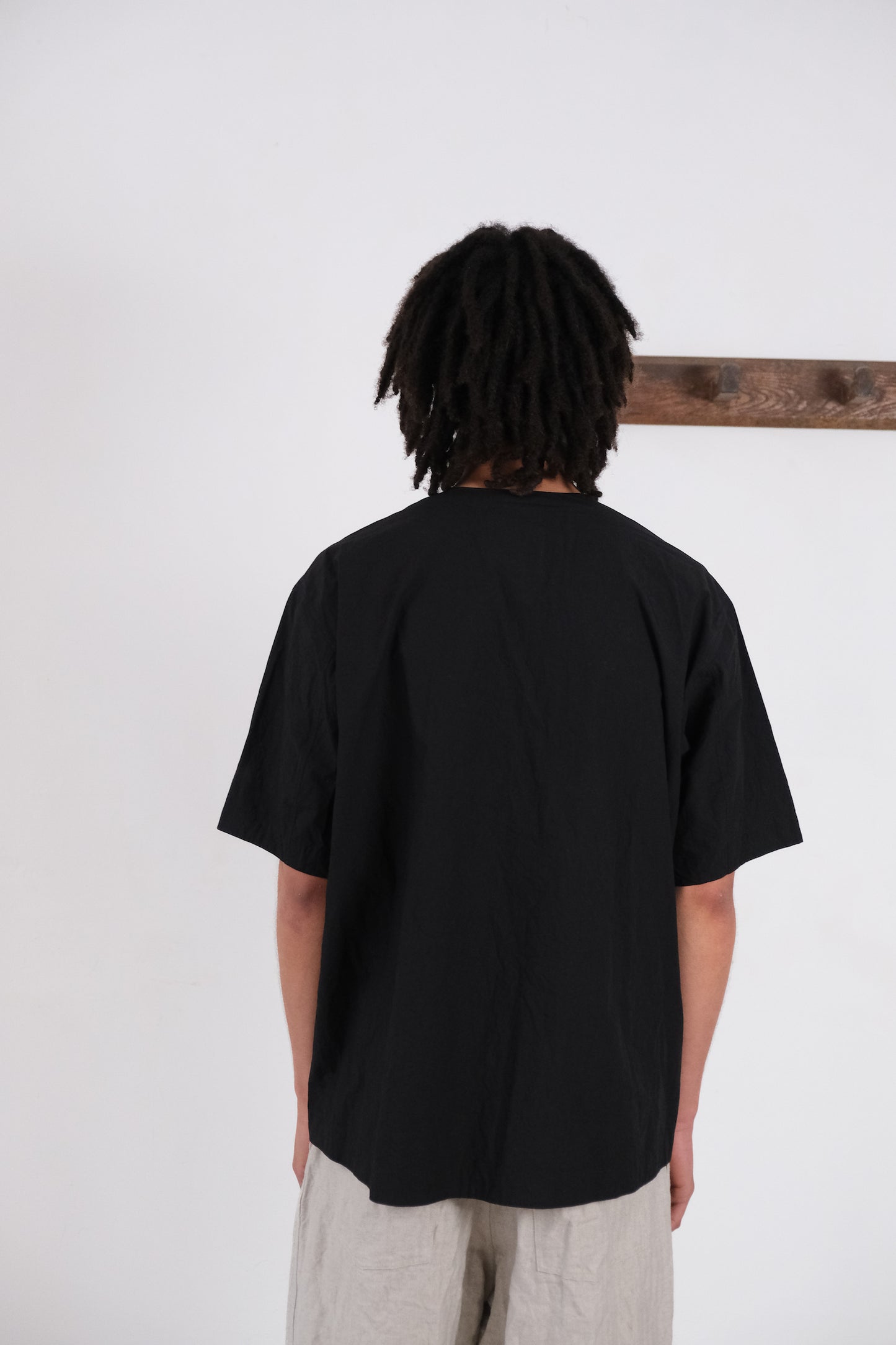 woven tee, black ultra-dense typewriter