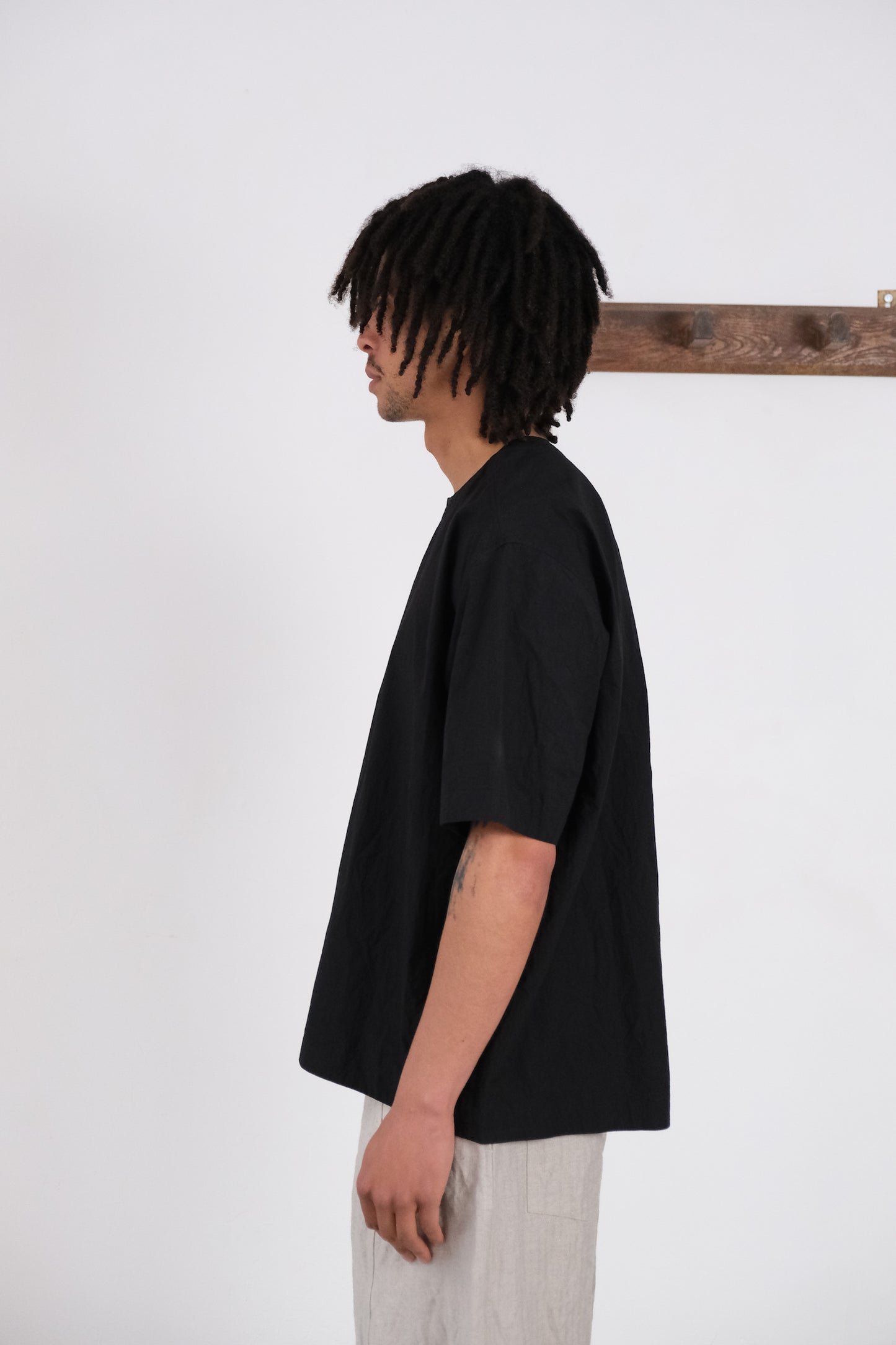 woven tee, black ultra-dense typewriter