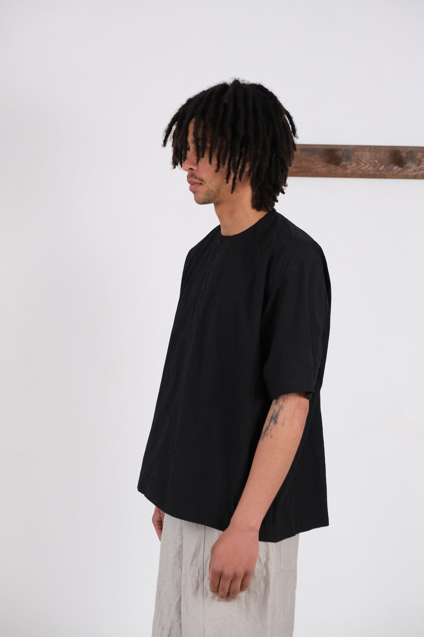 woven tee, black ultra-dense typewriter