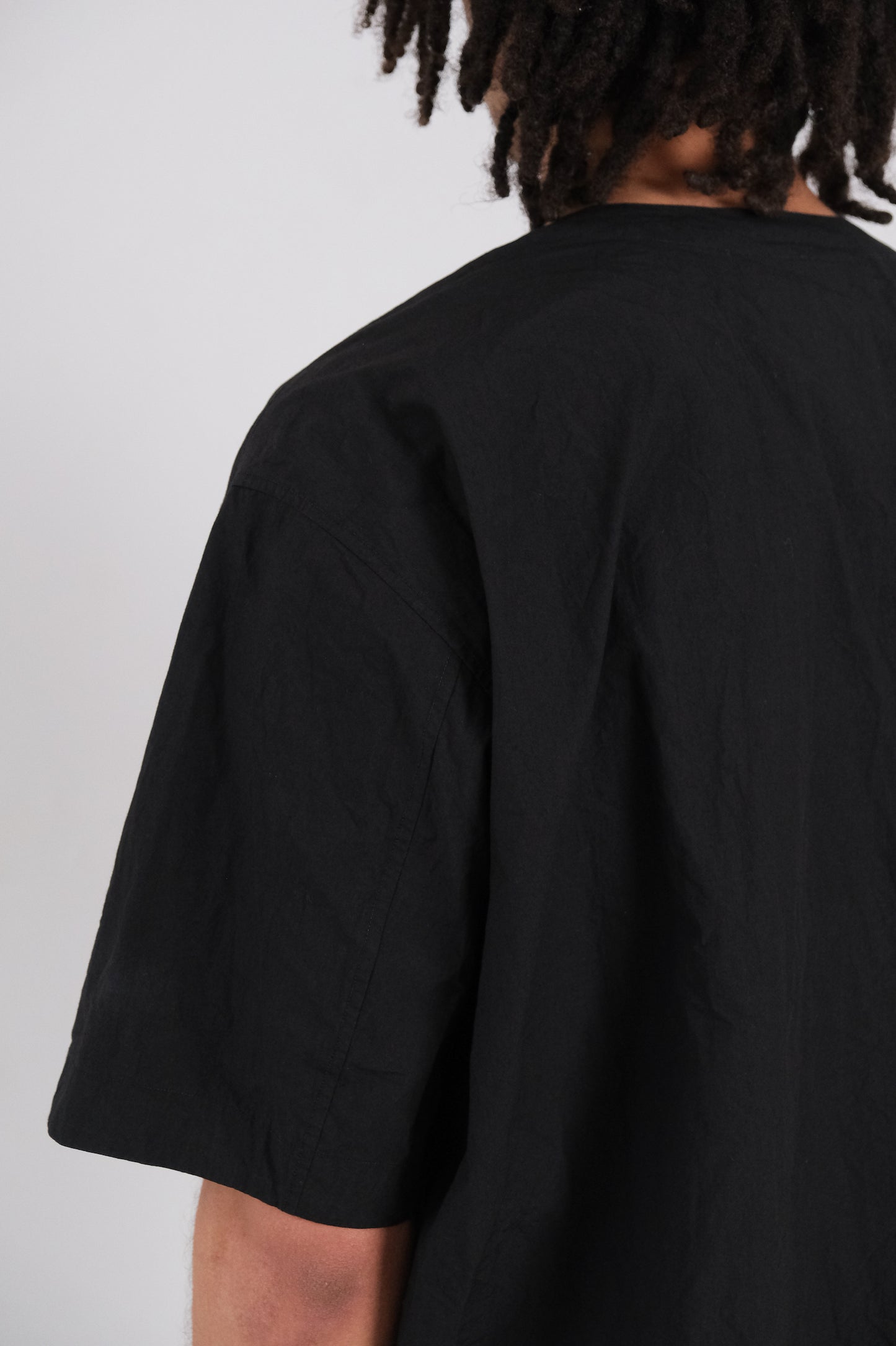 woven tee, black ultra-dense typewriter