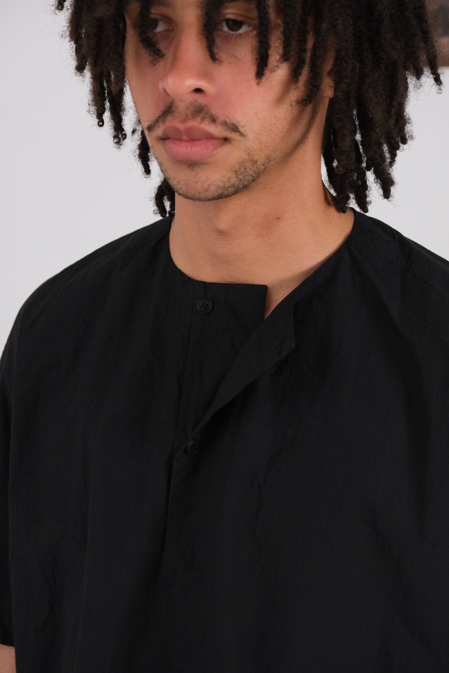woven tee, black ultra-dense typewriter